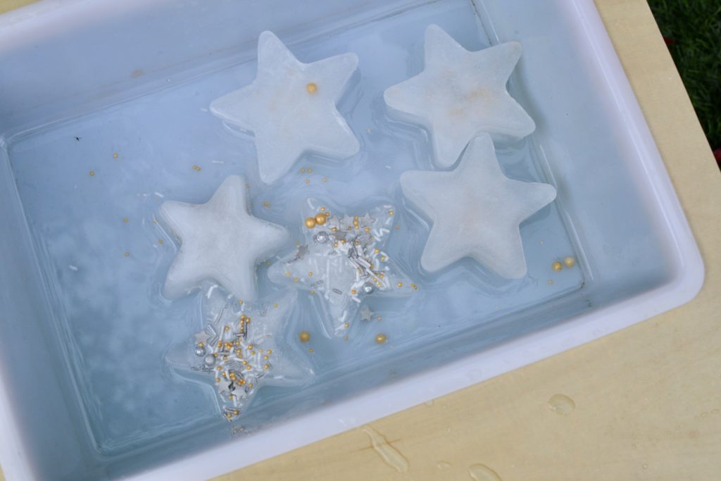 Frozen sparkly stars in water for a science experiment