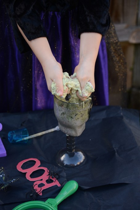 hands in spider slime for Halloween