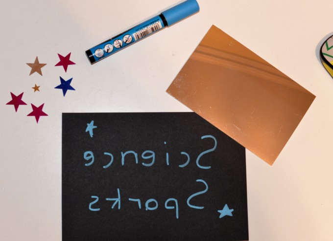 Image of backwards writing in a mirror as part of a Leonardo Da Vinci activity
