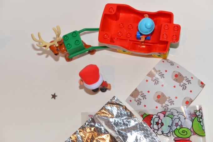 DUPLO sleigh and a selection of waterproof materials for an elf on the shelf STEM challenge