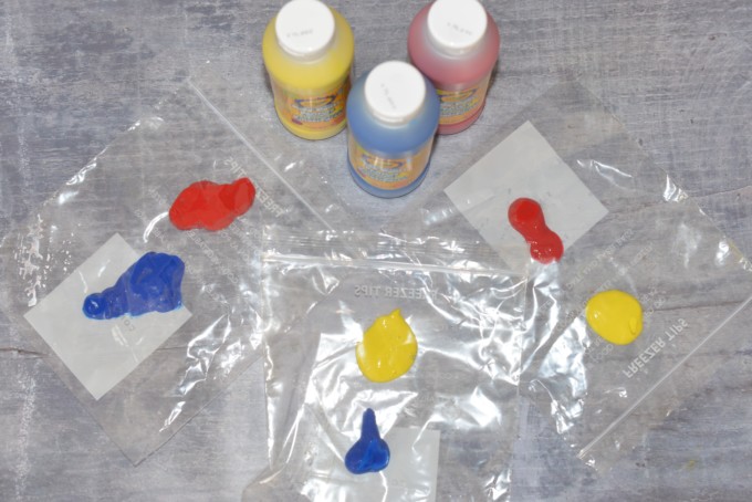 yellow, blue and red paint with 3 sealable plastic bags for a colour mixing activity.