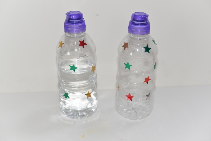 2 water bottles , one empty and one full of water for a Galilieo gravity experiment