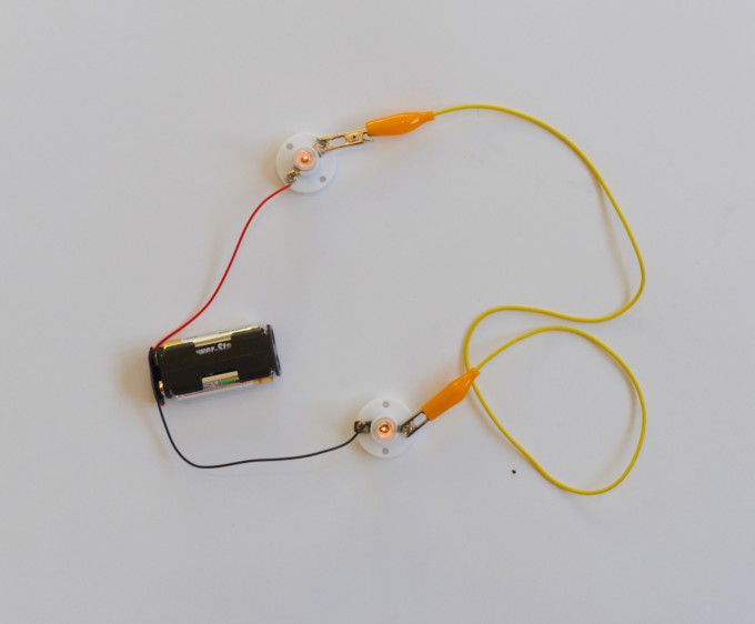 series circuit made using a battery pack, wires and two bulbs - circuits for kids
