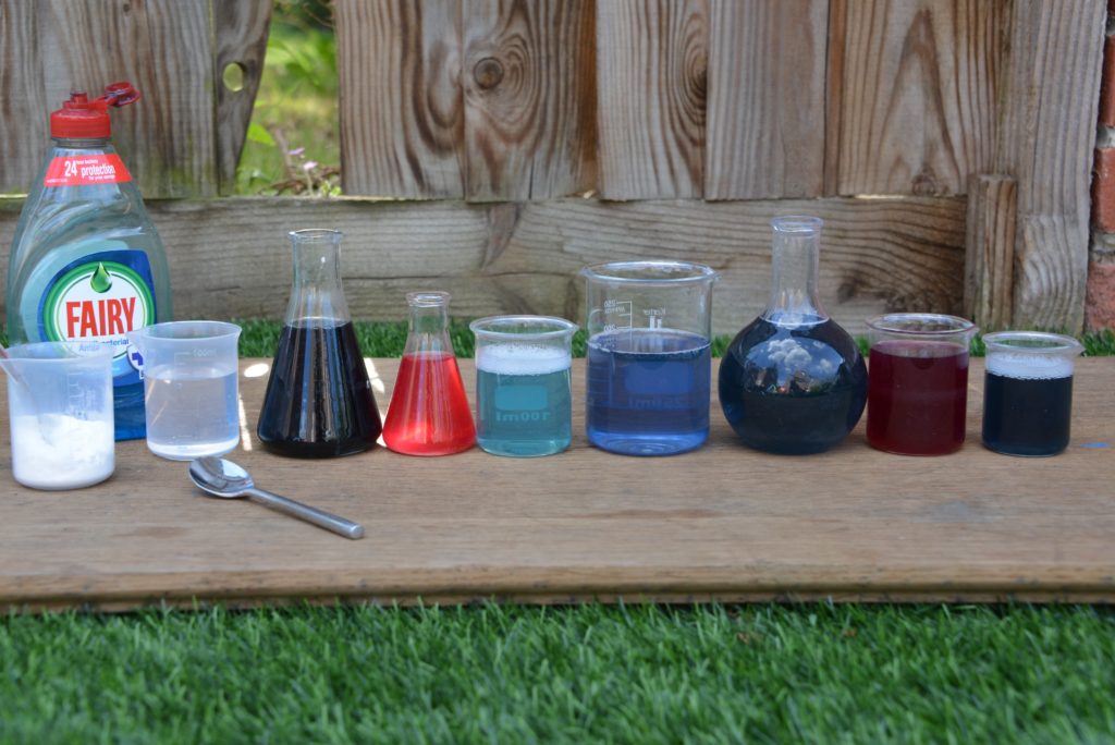 different size and shaped containers filled with red cabbage indicator of different colours