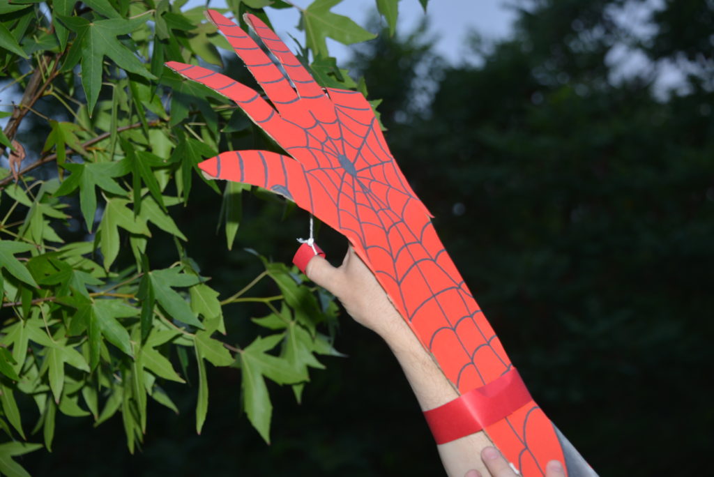 Spiderman arm made using cardboard and string as part of a fun STEM project!