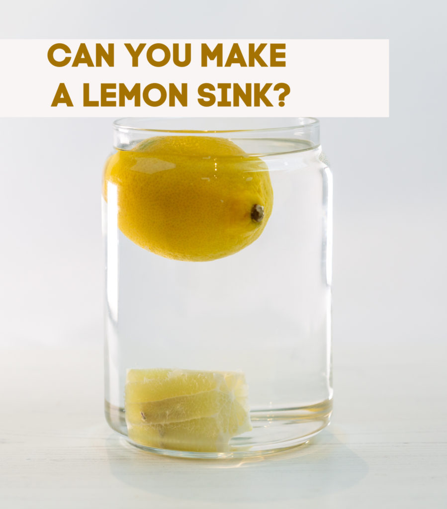 a large glass jar filled with water. A whole lemon is floating on top of the water and the inside of the lemon has sunk to the bottom.