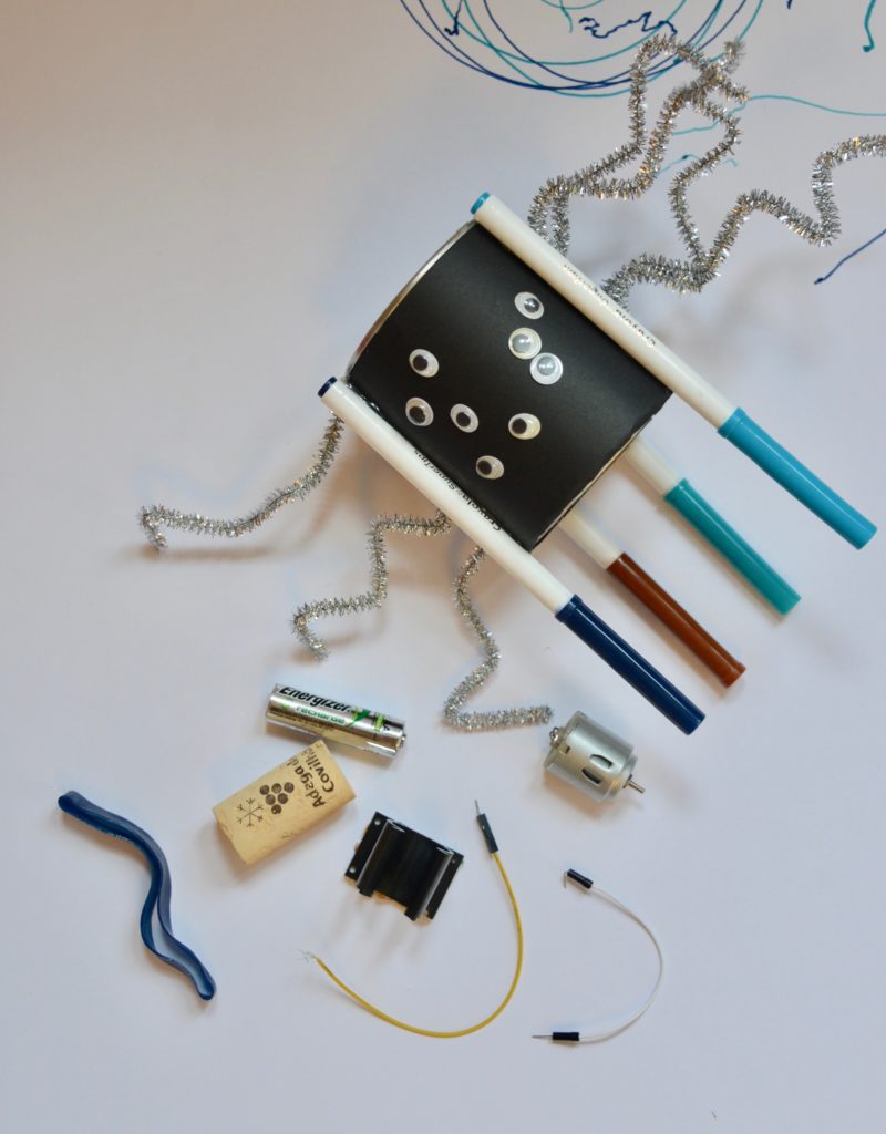 Everything you need to make a Halloween themed drawing robot - wires, motor, battery and elastic band