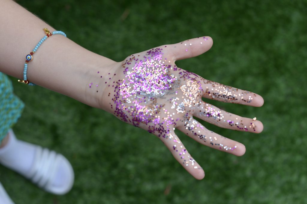 Glitter on hands as part of a handwashing activity