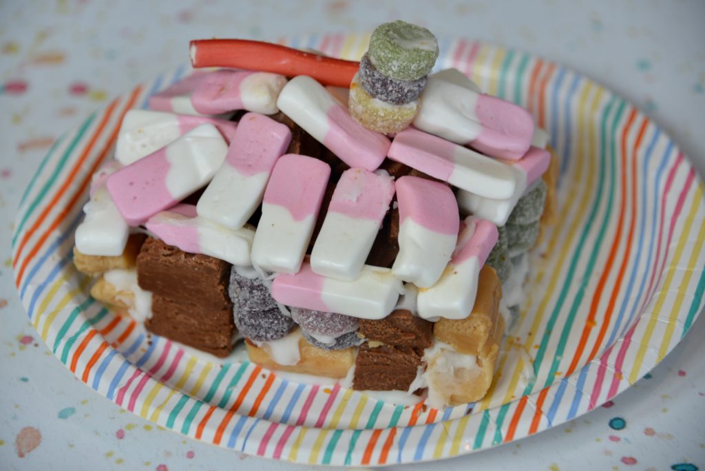 A candy house made from sweets and chocolate for a science project or STEM challenge