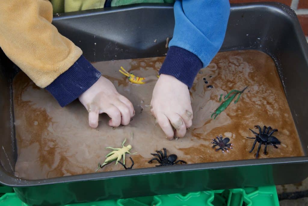 Bug oobleck made with cornflour, water and brown food colouring