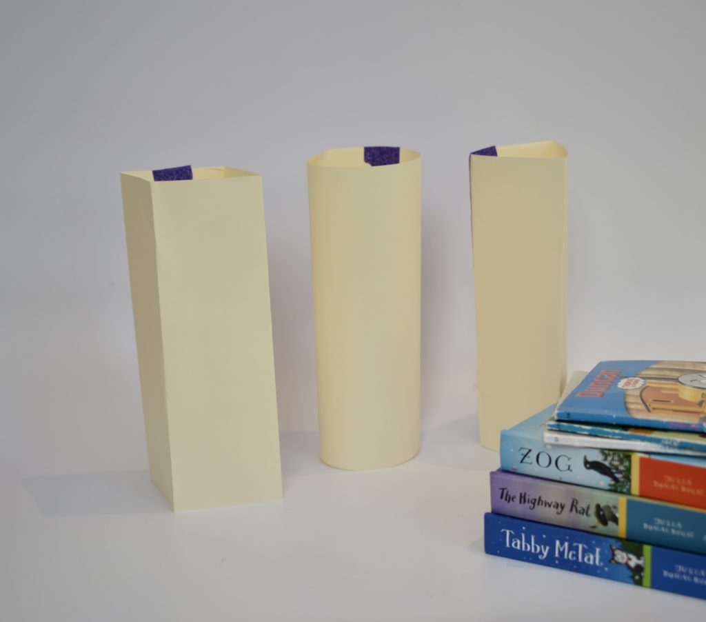 3 different shaped paper columns for a how strong is paper experiment