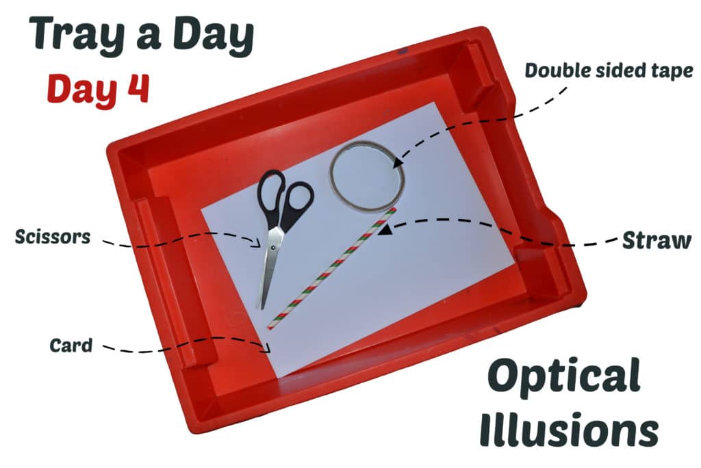 A red tray with scissors, tape, a straw and white cardstock inside