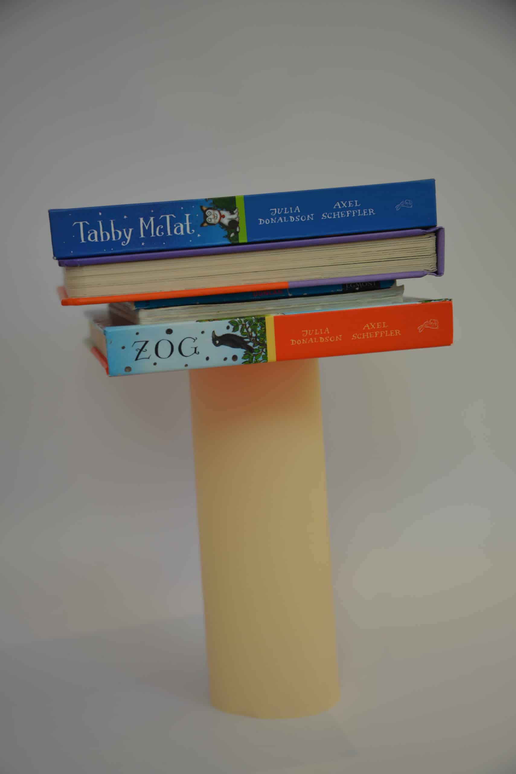 paper column with books balanced on top for a strong shape activity