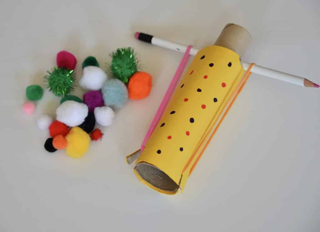 Easy cardboard slingshot - DIY Slingshot made with two cardboard tubes, a pencil and elastic band