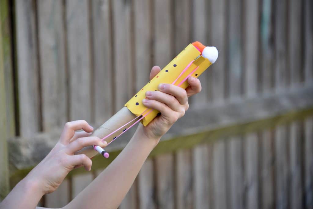 Easy cardboard slingshot made for a cardboard STEM Challenge