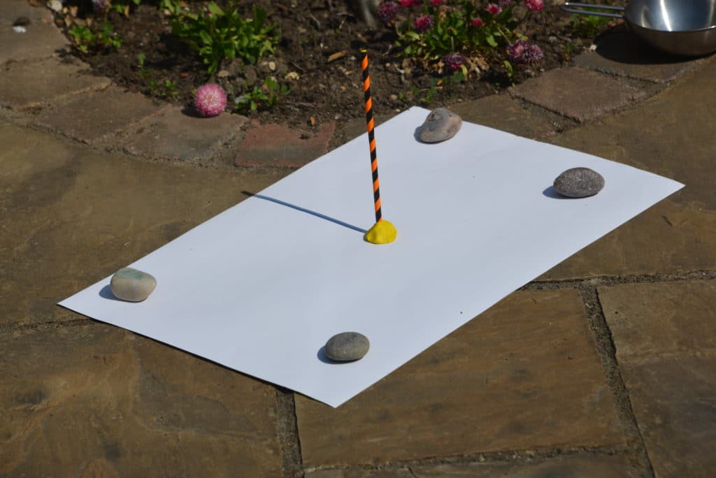 Sundial made with  a straw and plastcine