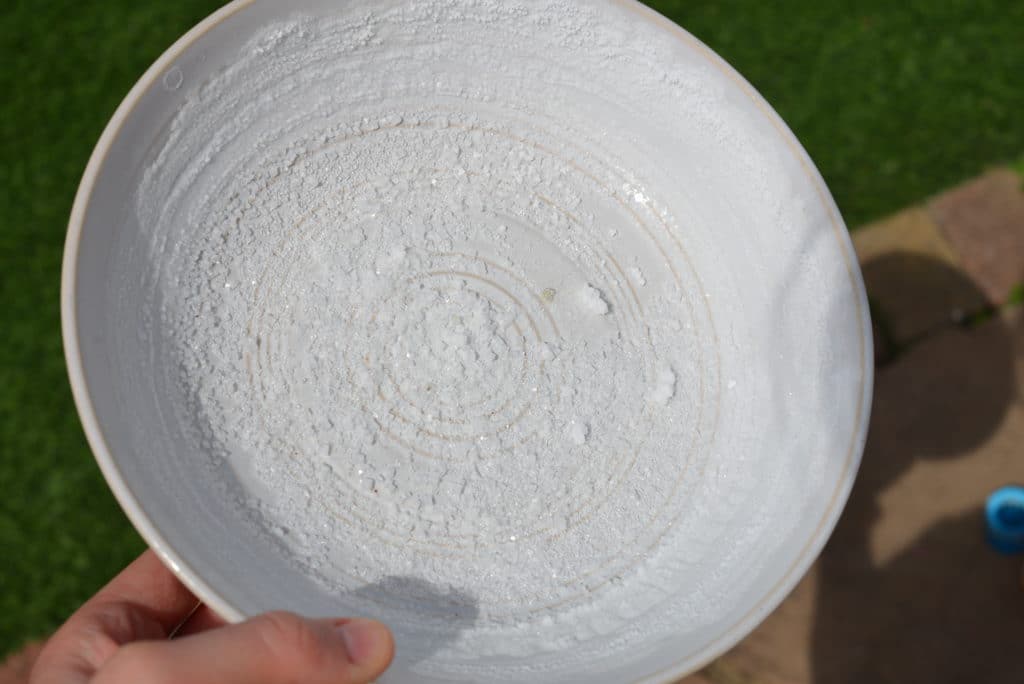 salt crystals on a white plate made by evaporation