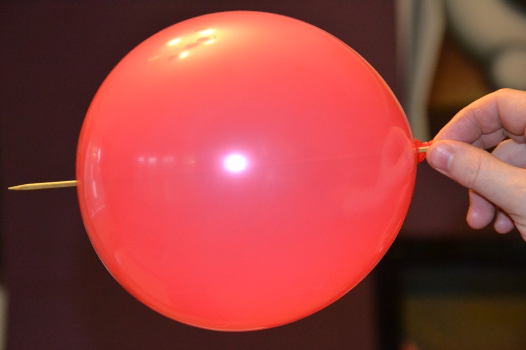 Skewer pushed through a balloon