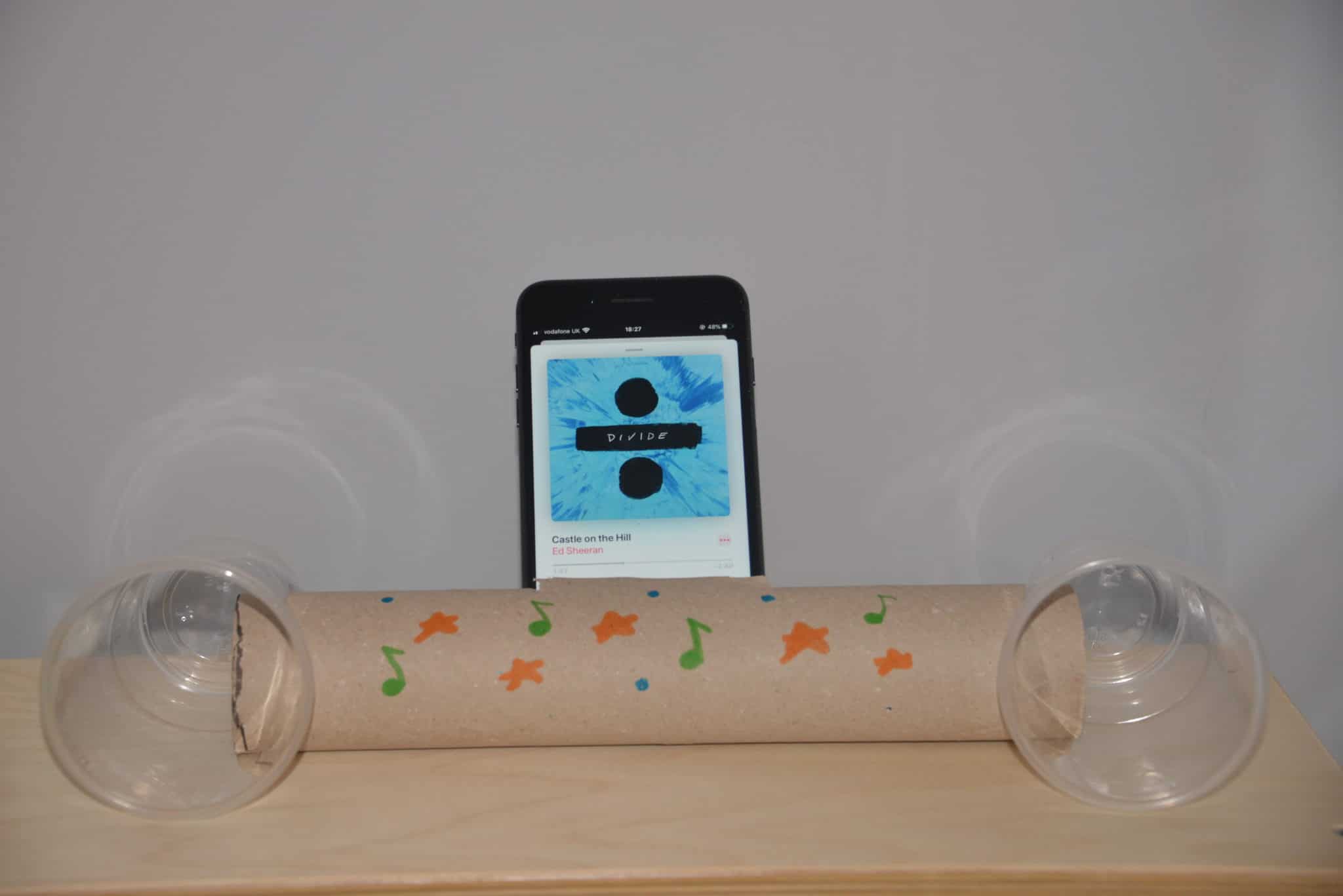 Image of a homemade speaker made using a cardboard tube and two plastic cups