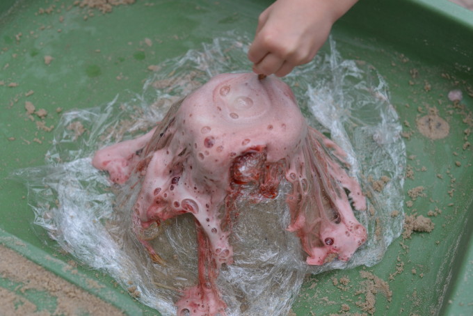 easy baking soda volcano covered in cling film so it can be reused