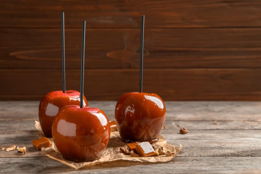 toffee apples sat on a wooden board for a changing state science activity