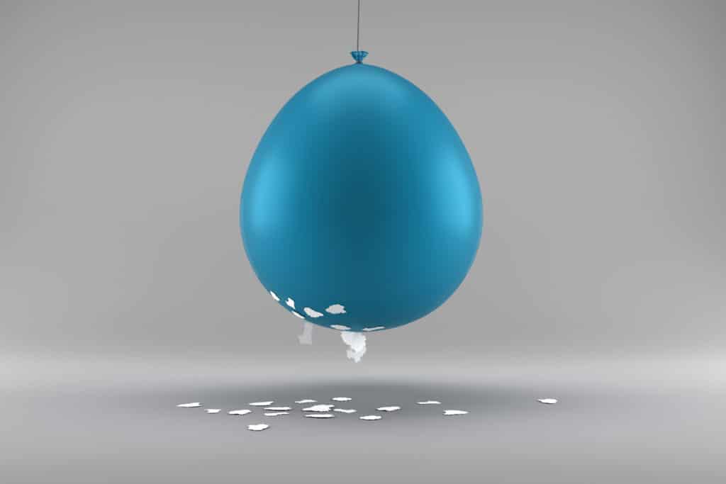 balloon charged with static electricity with tissue paper attached