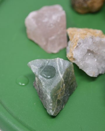 selection of rocks on a tray for a rock experiment for kids