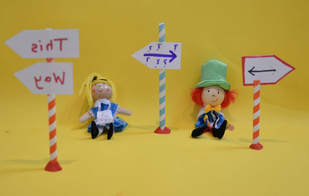 Alice in wonderland science activity using arrows and backwards signs