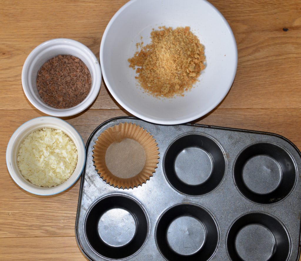 muffing tray with shaved choclates and crushed biscuits