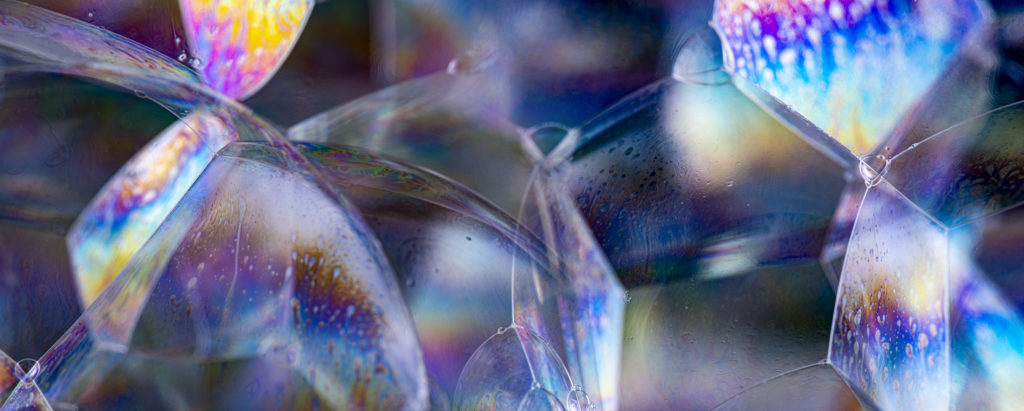 close up of bubbles showing the colours of the rainbow