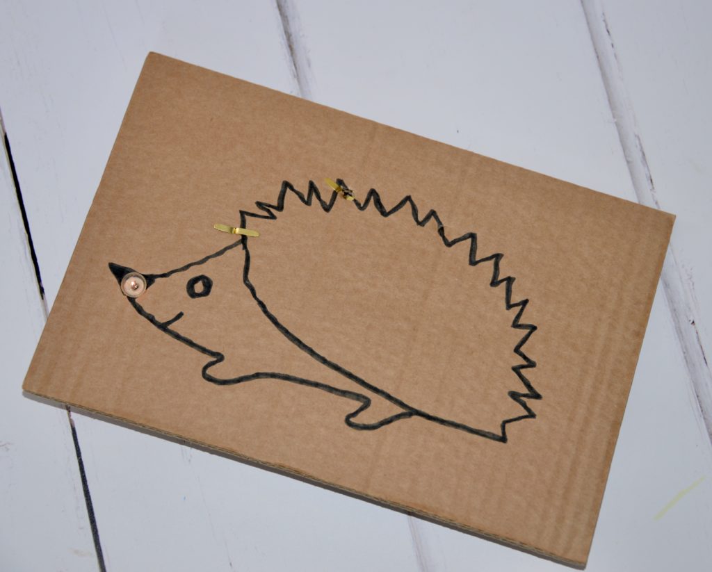 Drawing of a hedgehog with a circuit attached to light up the hedgehog nose