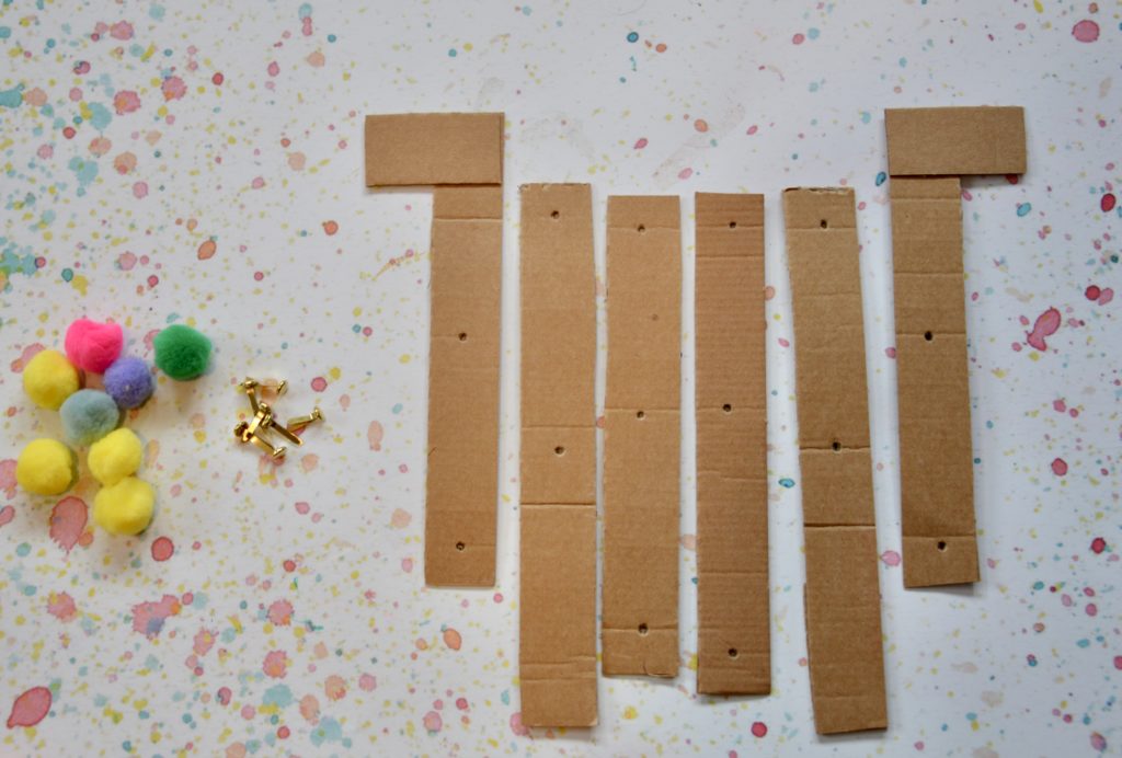 Articulated Grabber Materials - cardboard strips, pom poms and split pins