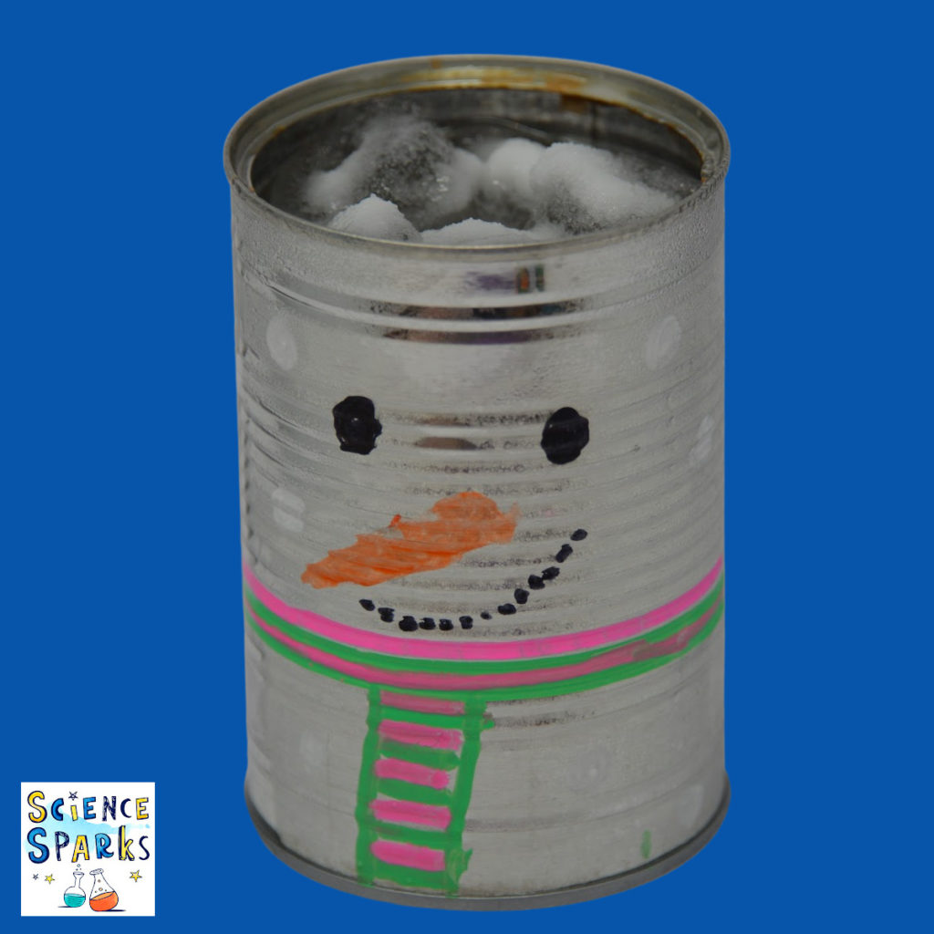A tin can made to look a snowman covered in frost from ice and salt for a winter science experiment
