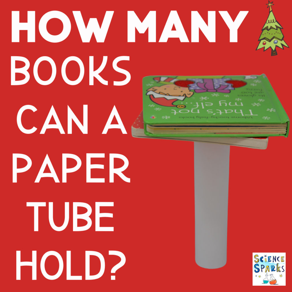 Christmas books balanced on a paper cylinder for a Christmas science experiment