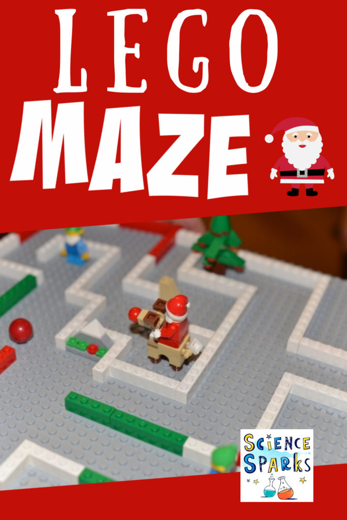 A maze made from lego on a grey flat board.