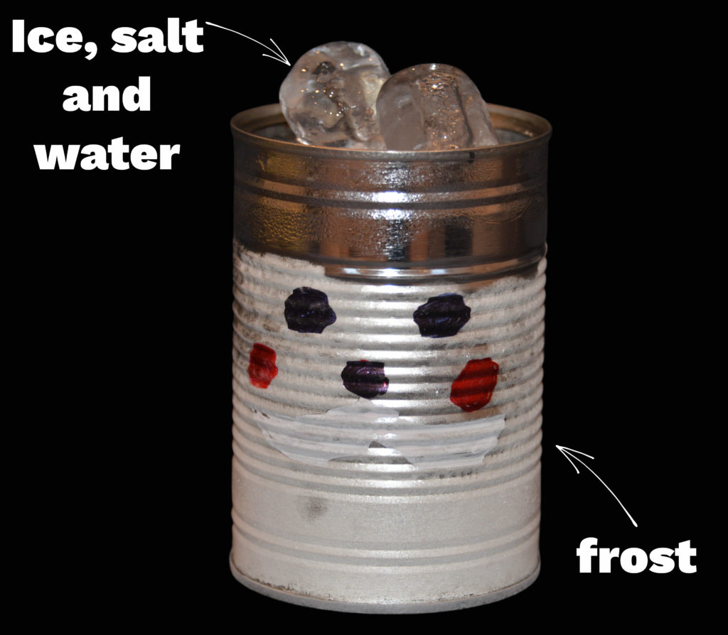 A tin can decorated like a Santa face with frost on the outside made by filling the can with ice and salt. A great Christmas STEM challenge