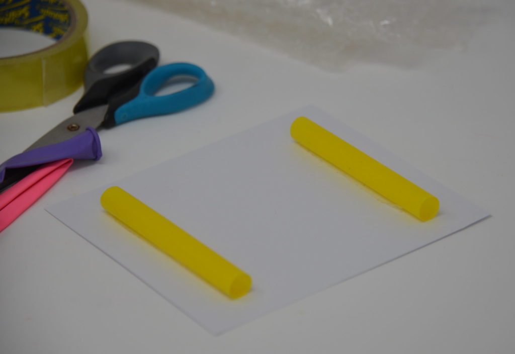 sheet of card with two straws attached reading for a bumper car STEM challenge