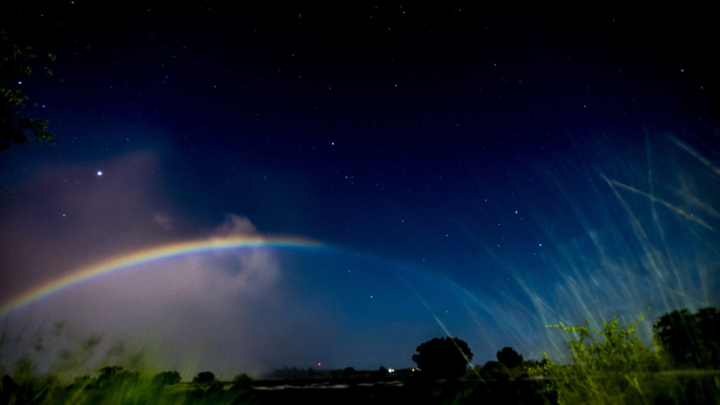 A moonbow in the night sky