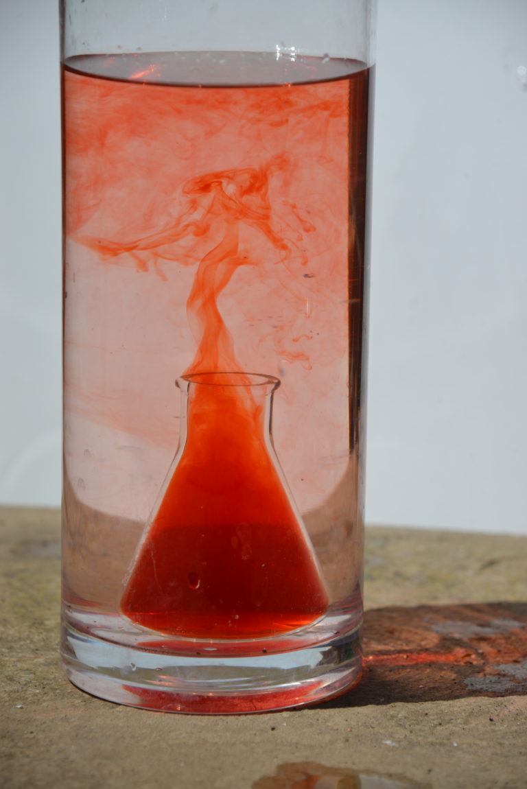 warmer red water rising through cooler water to show hot water rising