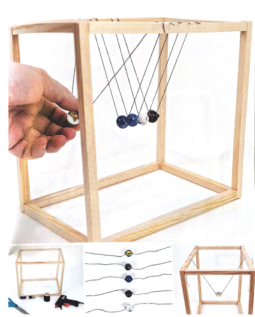 Newtons cradle made from marbles and a wooden frame