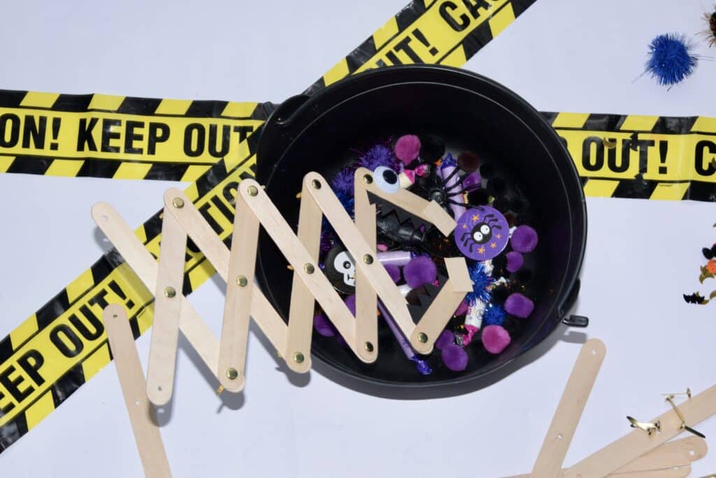 Candy grabber made from craft sticks for a Halloween STEM challenge