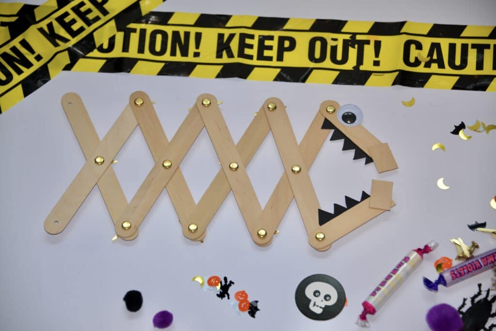 Monster themed craft stick grabber for Halloween