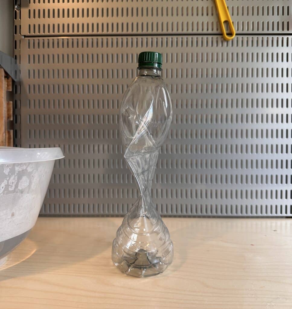Plastic bottle that has been compressed
