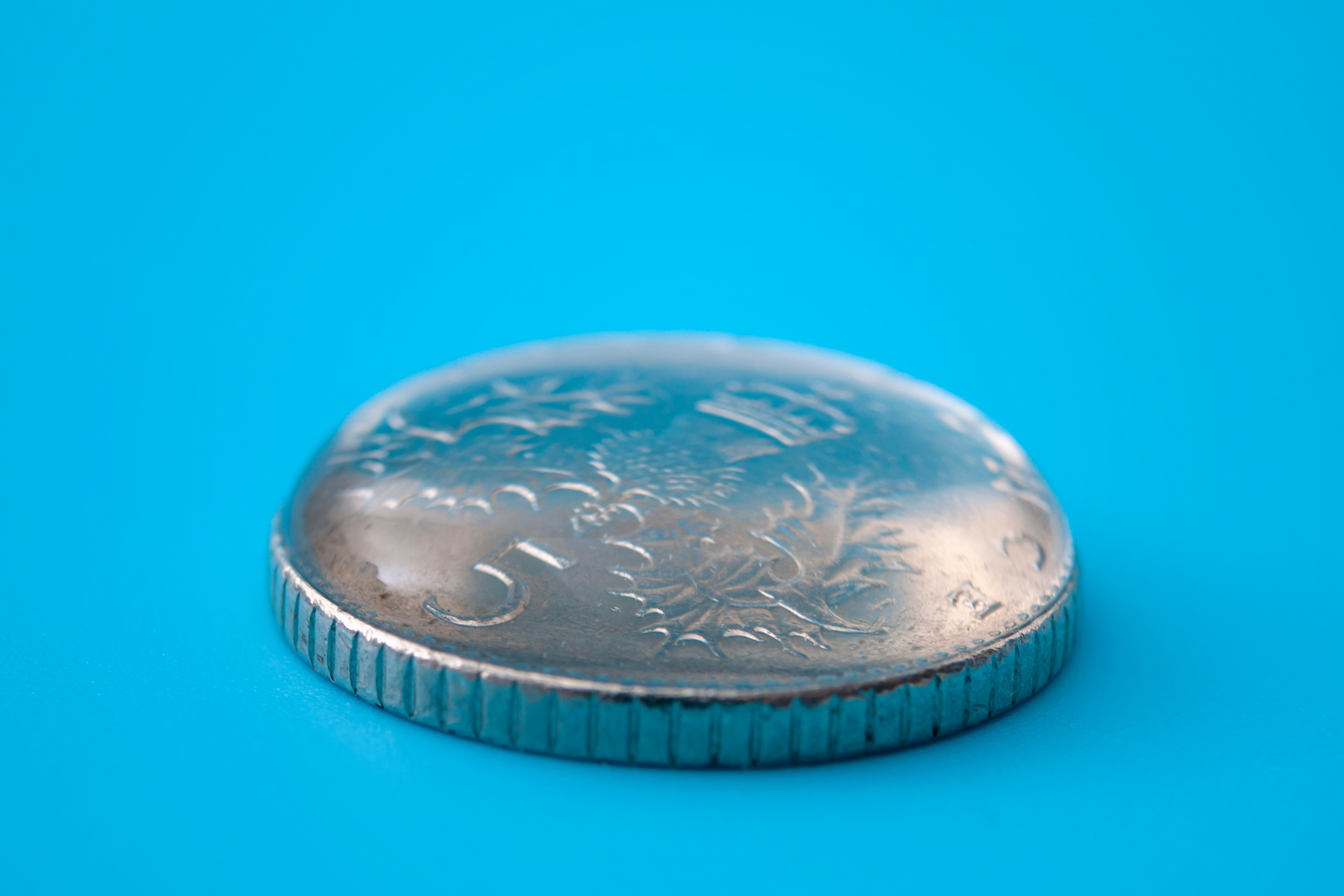 water on a coin for a surface tension activity