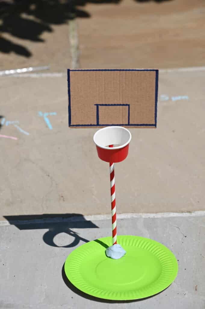 Basketball hoop made from a paper plate, straw and small cup